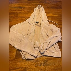 Medium Forever 21 zip up jacket in a rose gold color.